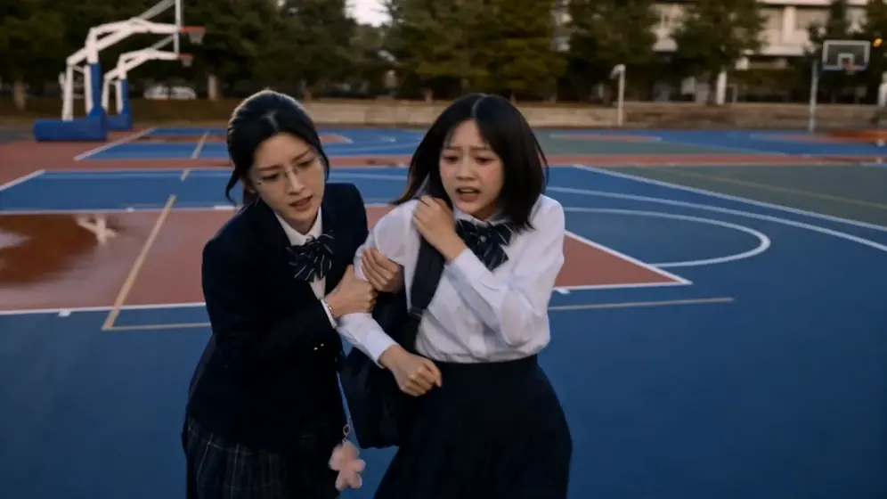 Two rivals on a school court, dynamic angle
